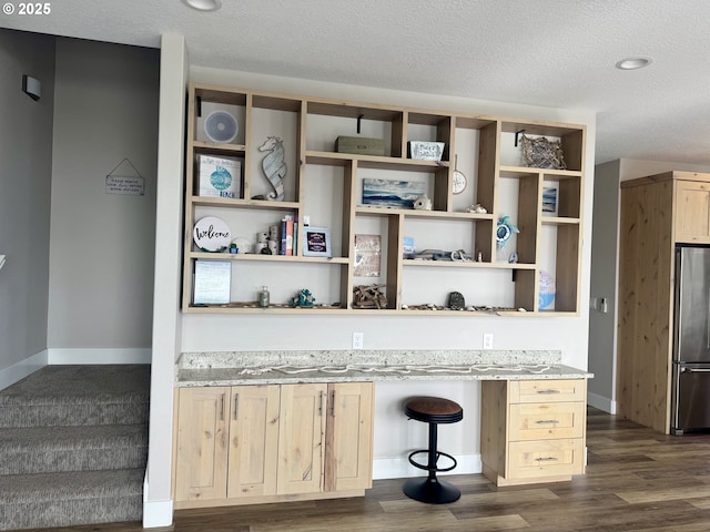 6604 NE Logan Rd, Lincoln City, OR 97367 - kitchen featuring freestanding refrigerator, light brown cabinets, dark wood-style floors, open shelves, and a textured ceiling