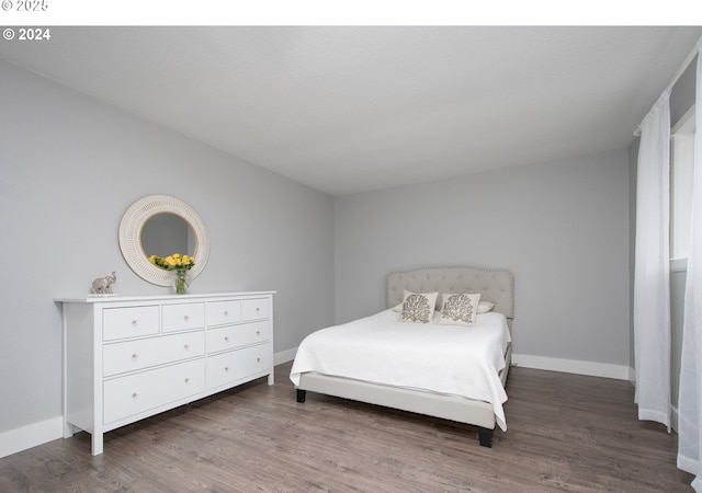 bedroom featuring dark hardwood / wood-style floors