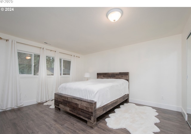 bedroom featuring dark hardwood / wood-style flooring