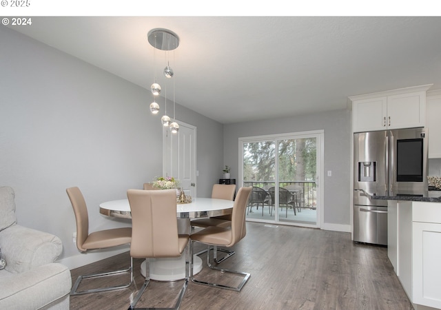 dining area featuring dark hardwood / wood-style flooring