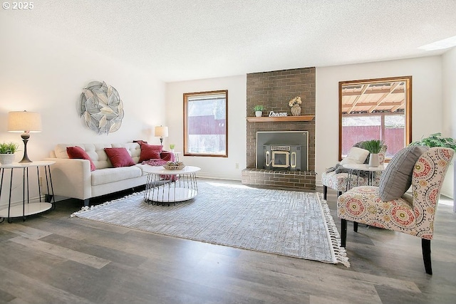 living room with a textured ceiling and wood finished floors