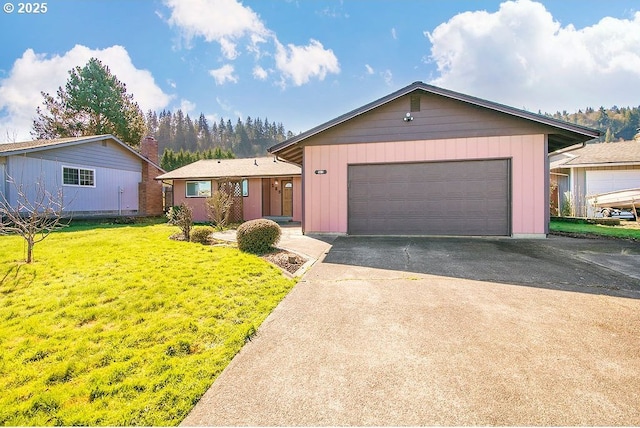 single story home featuring a garage, a front yard, driveway, and board and batten siding