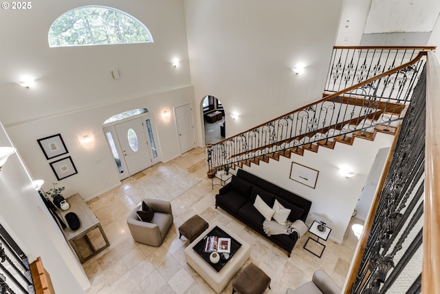 27161 Briggs Hill Rd, Eugene, OR 97405 - living area featuring a high ceiling, stairs, and baseboards