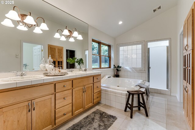 27161 Briggs Hill Rd, Eugene, OR 97405 - bathroom with a chandelier, a tub with jets, double vanity, tile patterned flooring, and recessed lighting