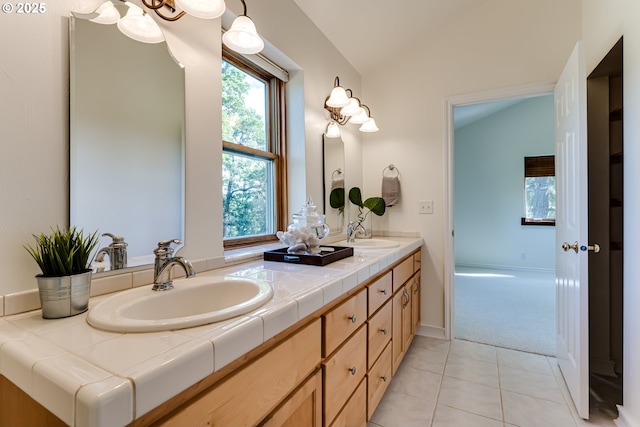 27161 Briggs Hill Rd, Eugene, OR 97405 - bathroom with double vanity, lofted ceiling, tile patterned floors, and baseboards