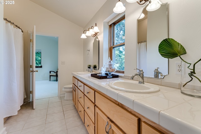 27161 Briggs Hill Rd, Eugene, OR 97405 - full bath with vaulted ceiling, double vanity, toilet, and tile patterned floors