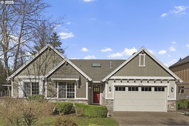 view of front facade featuring driveway, a garage, a shingled roof, stone siding, and board and batten siding