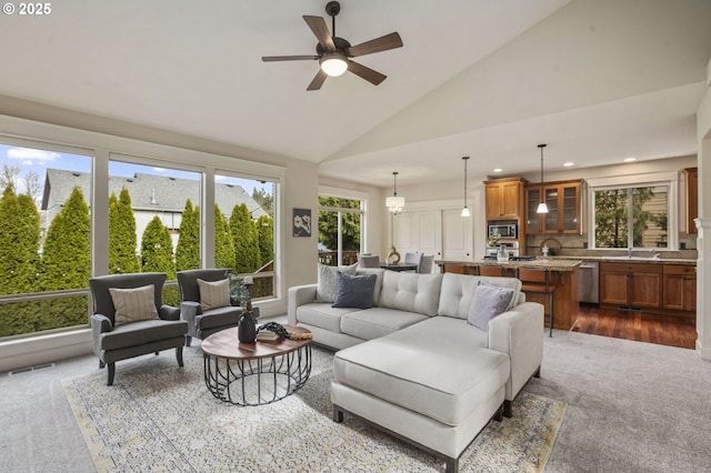 living room featuring visible vents, a ceiling fan, dark carpet, high vaulted ceiling, and recessed lighting