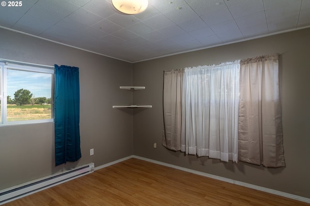 78613 Powerline Rd, Hermiston, OR 97838 - spare room featuring baseboard heating and wood finished floors