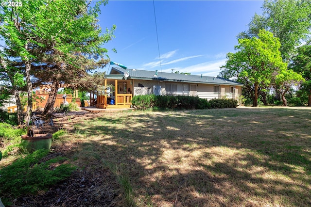 78613 Powerline Rd, Hermiston, OR 97838 - rear view of house featuring a yard and covered porch