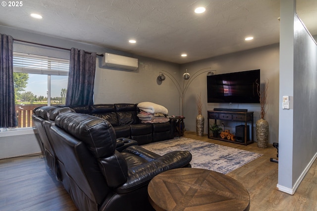 78613 Powerline Rd, Hermiston, OR 97838 - living area featuring a wall mounted AC, wood finished floors, and recessed lighting