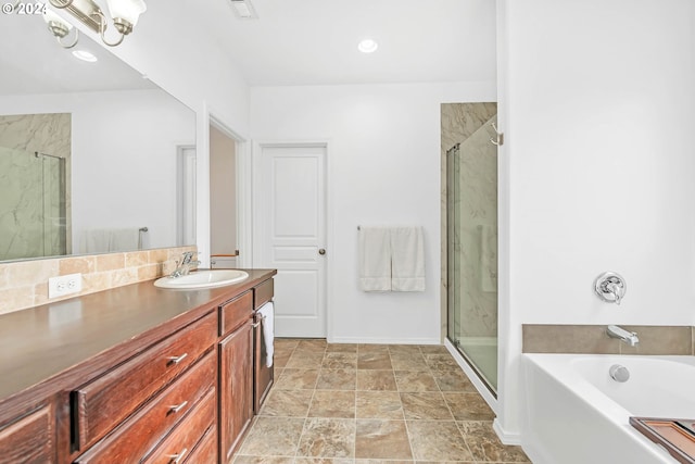 bathroom with a bath, a shower stall, visible vents, and vanity