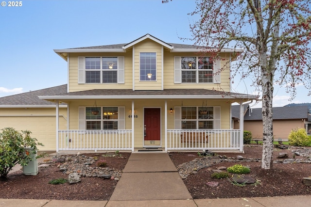 view of front facade with a porch, a garage, and a shingled roof