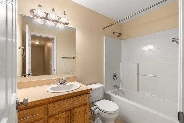 bathroom featuring shower / bathing tub combination, toilet, and vanity