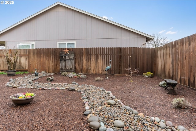 view of yard with a fenced backyard