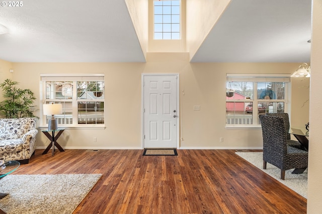 entryway featuring wood finished floors and baseboards