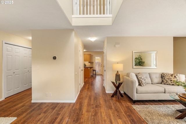 living area with wood finished floors and baseboards