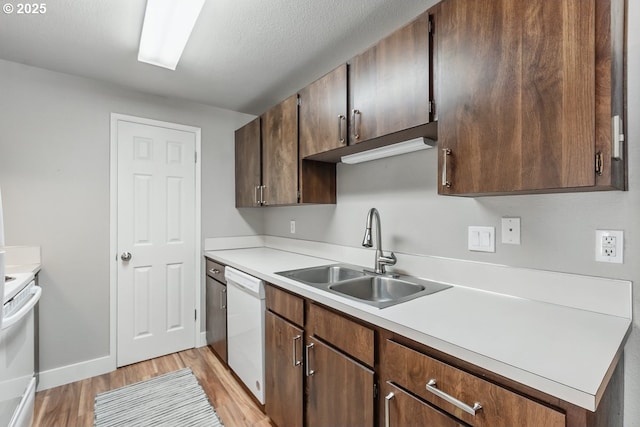 1100 N Meridian St Unit 46, Newberg, OR 97132 - kitchen with white appliances, light wood finished floors, and light countertops