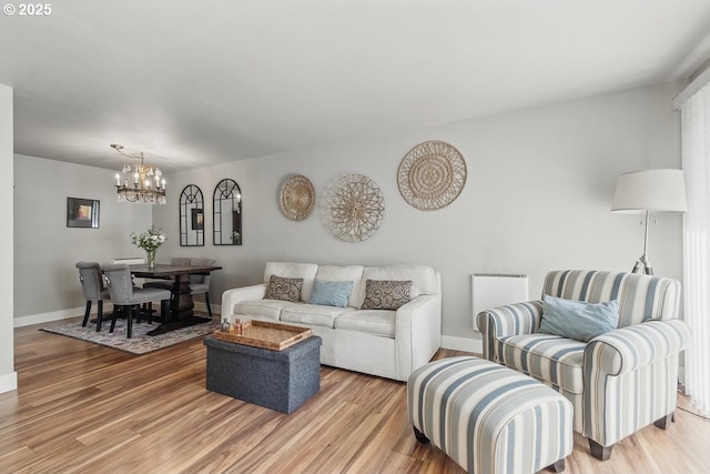 1100 N Meridian St Unit 46, Newberg, OR 97132 - living room featuring a chandelier and light wood-style flooring