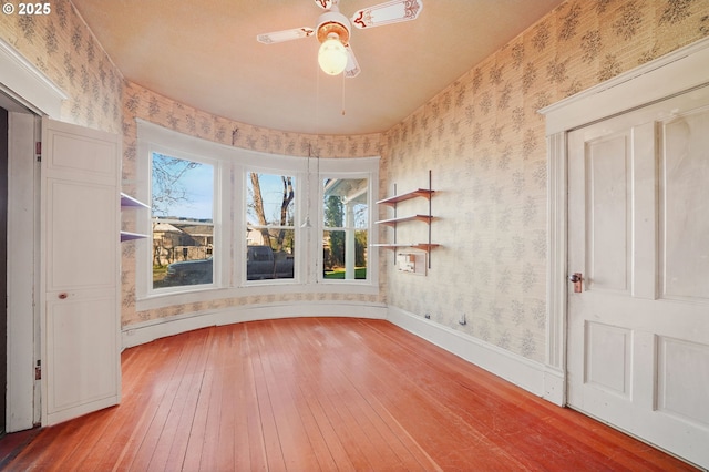 interior space featuring hardwood / wood-style flooring and ceiling fan