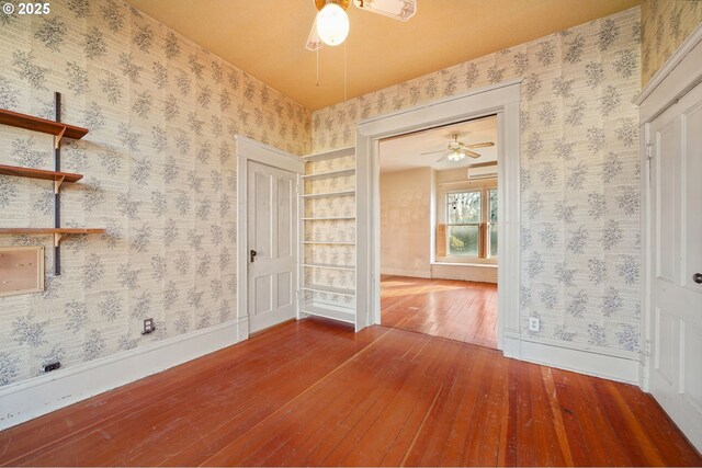 unfurnished room featuring hardwood / wood-style floors and ceiling fan