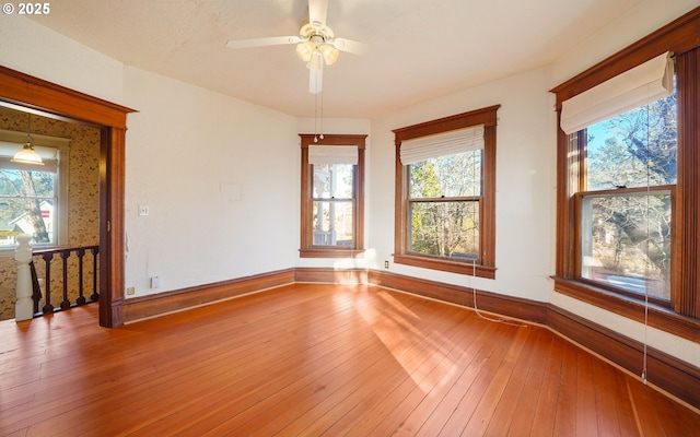 spare room featuring hardwood / wood-style flooring and ceiling fan