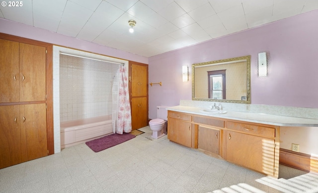 full bathroom with vanity, shower / bath combination with curtain, and toilet