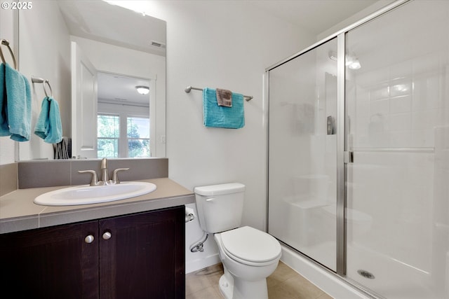 28671 SW Orleans Ave, Wilsonville, OR 97070 - bathroom with a shower stall, toilet, vanity, and tile patterned flooring
