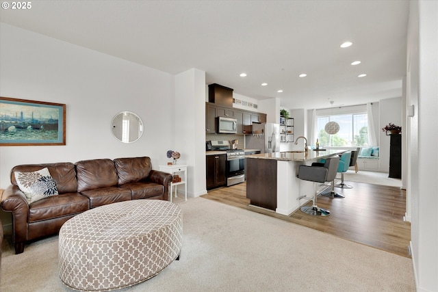 28671 SW Orleans Ave, Wilsonville, OR 97070 - living room featuring recessed lighting, light carpet, and baseboards