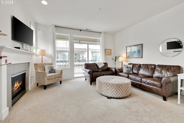 28671 SW Orleans Ave, Wilsonville, OR 97070 - living area with carpet floors, a glass covered fireplace, and baseboards