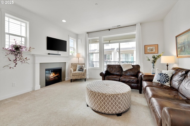 28671 SW Orleans Ave, Wilsonville, OR 97070 - living area featuring carpet, a fireplace, baseboards, and recessed lighting
