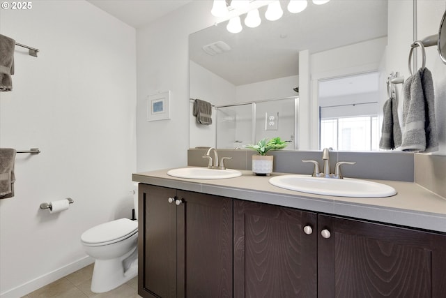 28671 SW Orleans Ave, Wilsonville, OR 97070 - bathroom featuring double vanity, a stall shower, tile patterned flooring, toilet, and baseboards