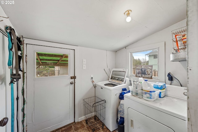 washroom featuring laundry area, washer and dryer, and plenty of natural light