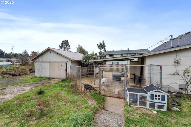 view of yard featuring an outdoor structure and fence