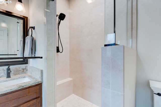 bathroom featuring a shower stall and vanity