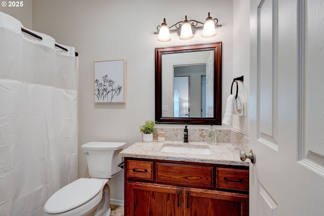 full bathroom featuring toilet and vanity