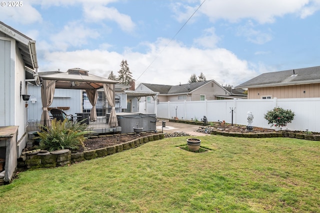 view of yard with a gazebo, a hot tub, and a patio area