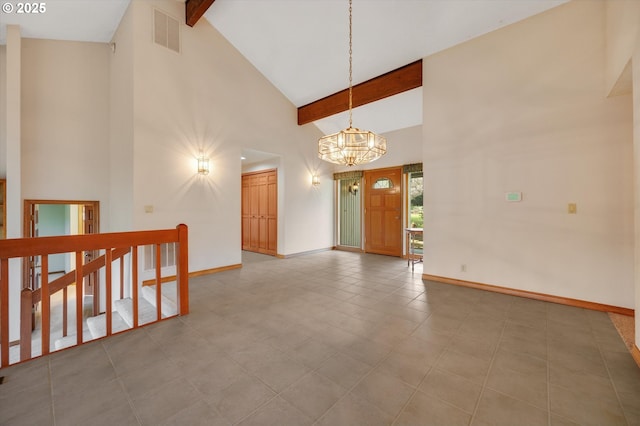 interior space with high vaulted ceiling, beam ceiling, visible vents, and baseboards