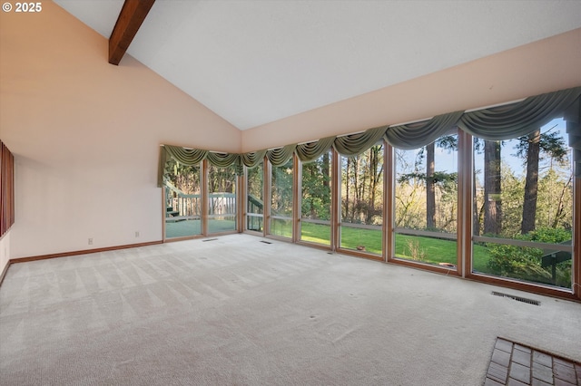 unfurnished sunroom featuring lofted ceiling with beams and visible vents