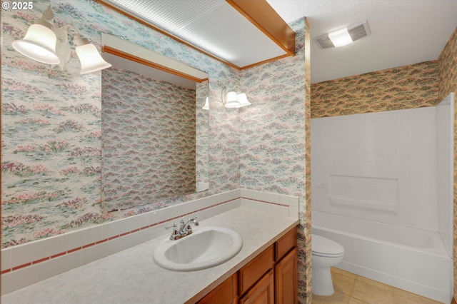 bathroom featuring toilet, tile patterned floors, visible vents, and wallpapered walls