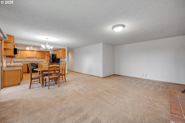 dining area with a textured ceiling, baseboards, a notable chandelier, and light colored carpet