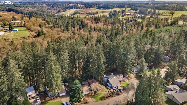 birds eye view of property with a forest view