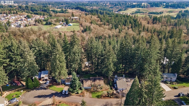 drone / aerial view with a view of trees