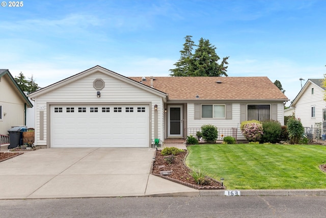 163 W Clackamas Cir, Woodburn, OR 97071 - ranch-style home featuring a front lawn, concrete driveway, and a garage