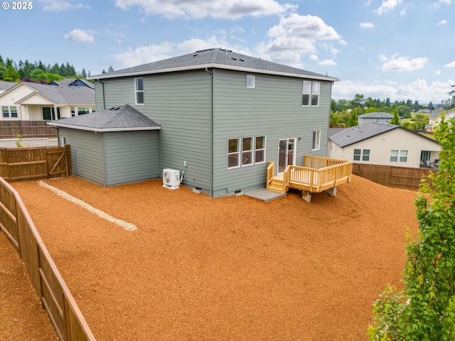 1512 W 14th Ave, La Center, WA 98629 - rear view of house featuring a wooden deck, crawl space, and a fenced backyard