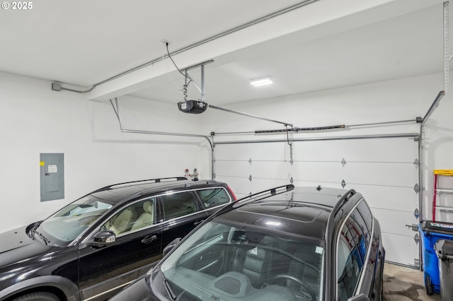 garage featuring electric panel and a garage door opener