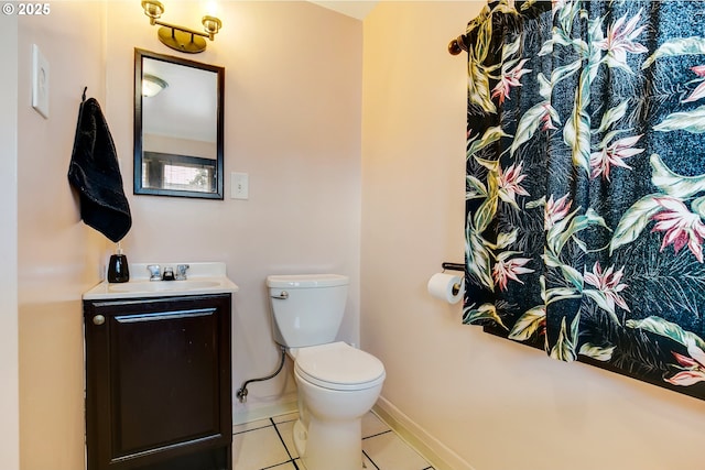 6308 SE 93rd Ave, Portland, OR 97266 - bathroom featuring vanity, baseboards, tile patterned floors, and toilet
