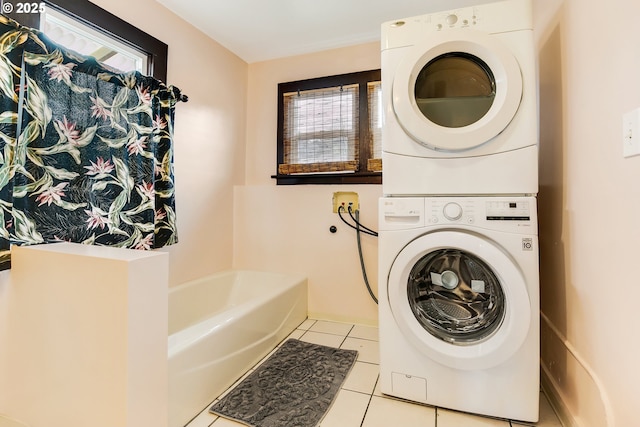6308 SE 93rd Ave, Portland, OR 97266 - laundry room with laundry area, stacked washer and clothes dryer, and tile patterned floors