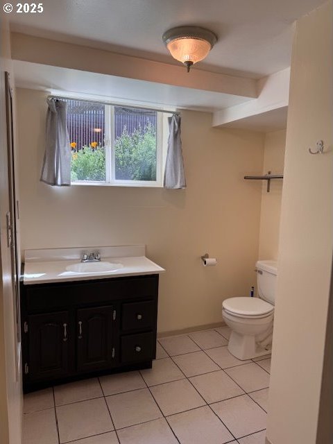 6308 SE 93rd Ave, Portland, OR 97266 - half bath with vanity, tile patterned floors, and toilet