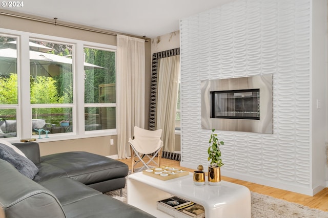 living area featuring wood finished floors and baseboards